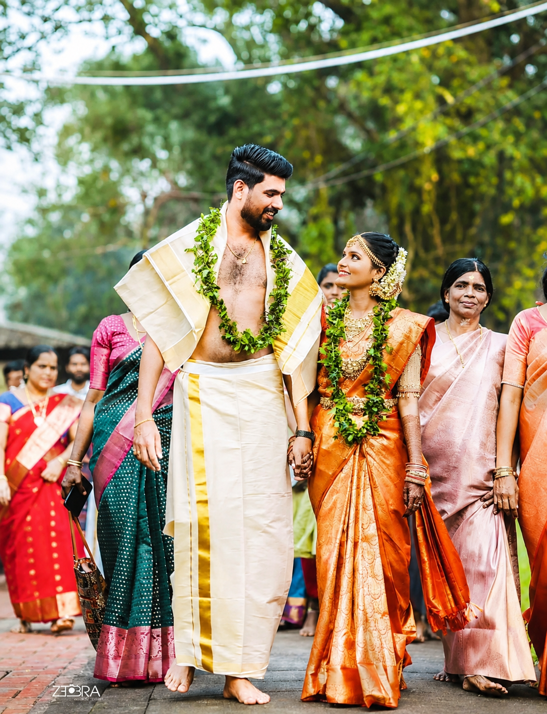 Bride and groom walking during an outdoor wedding ceremony