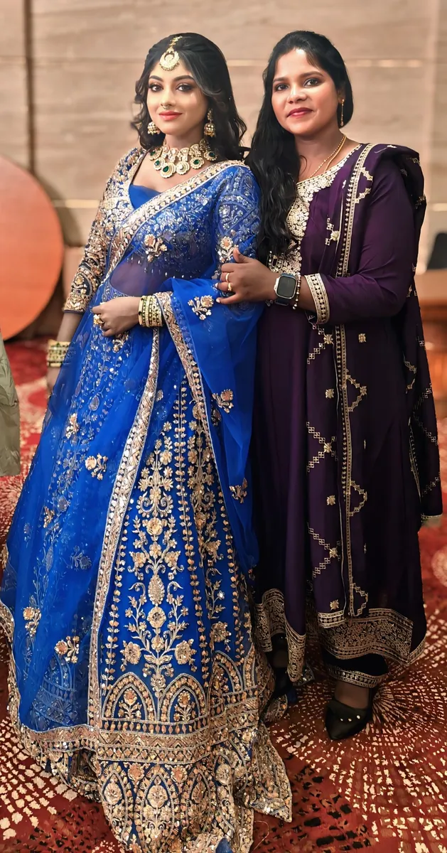 Blue bridal lehenga with embroidered details and jewellery