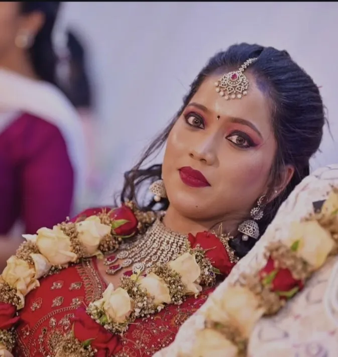 Close-up bridal portrait with red lip makeup and wedding jewellery